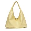 a6888411-7d24-4992-89bc-9ea8e8d73081 Minimalist, versatile handbag with a unique, niche appeal