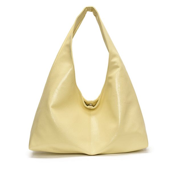 a6888411-7d24-4992-89bc-9ea8e8d73081 Minimalist, versatile handbag with a unique, niche appeal